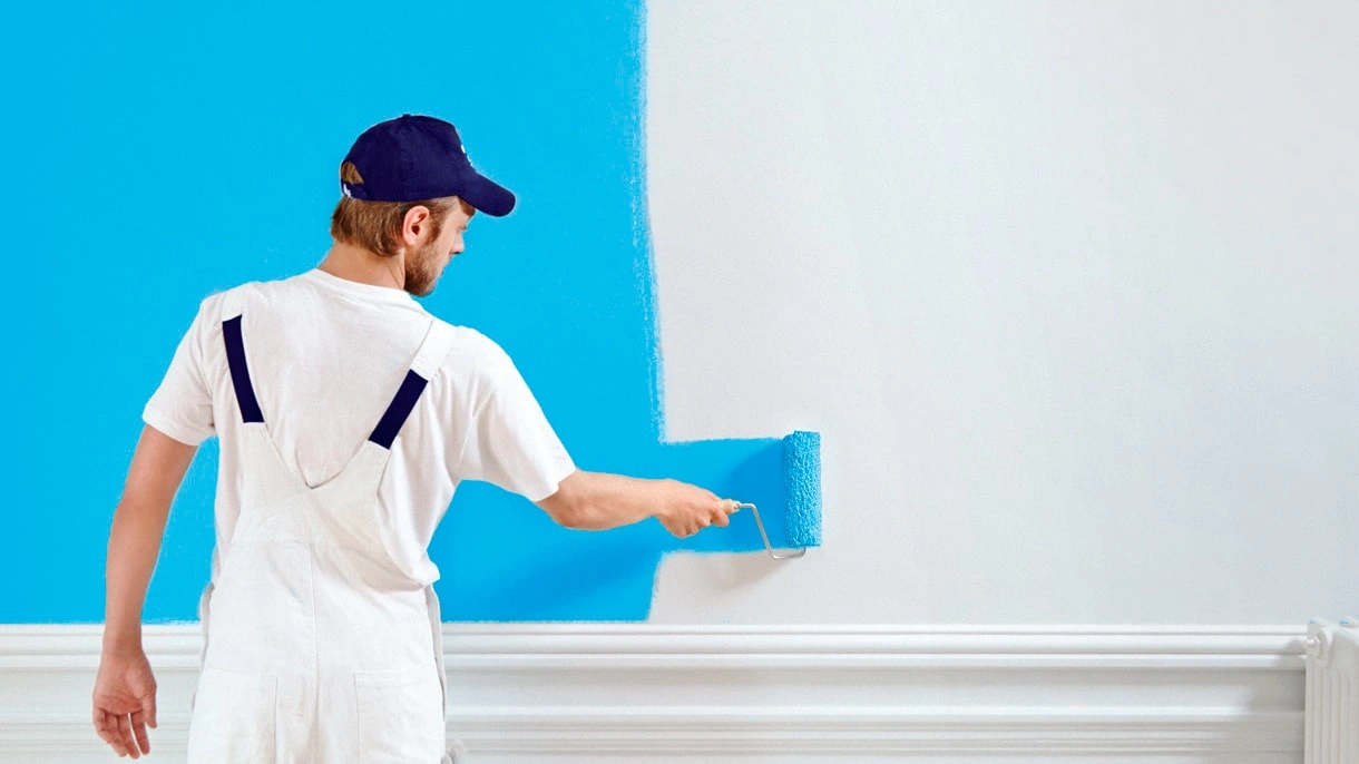 Professional painter transforming a home interior